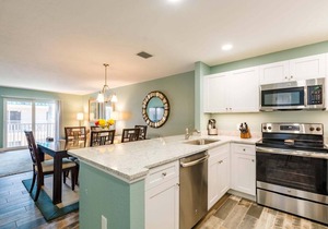 This third floor 2 bedroom 2 bathroom condominium is located on the Bayside
