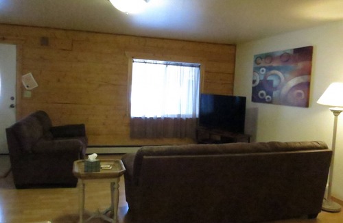 Moose Creek Apartment | Log 3-Bdr in Moose Creek among the birch and spruce trees