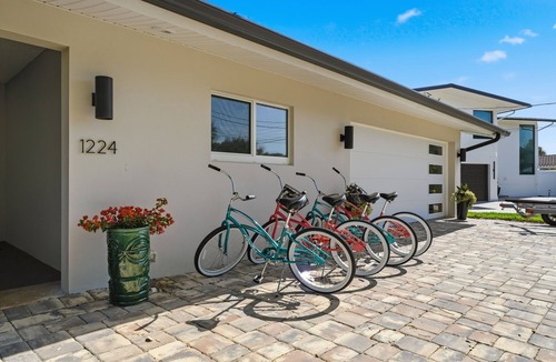 Cocoa Isles House | Luxury Waterfront Retreat Bikes, Hot Tub, Kayak, Walk to downtown Cocoa Beach.