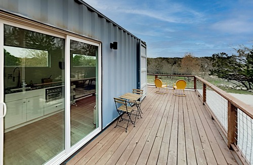Spicewood House | Modern Container Home with Wraparound Deck & Covered BBQ Area