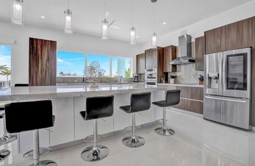 Coury House | P70 - Stunning 5 bed, 5 bath home with dockage and oversized private pool in Key Colony!