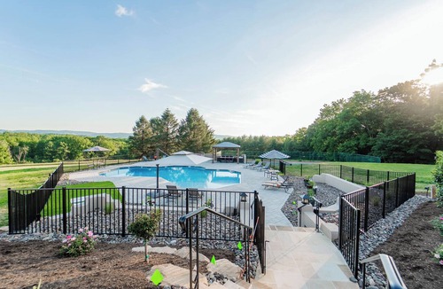 Wernersville House | Private 100-acre luxury estate for up to 30 guests with a resort-style pool, hot tub, game room, sports court, wellness spa, and sweeping sunset views—perfect for reunions, retreats, and unforgettable group stays.