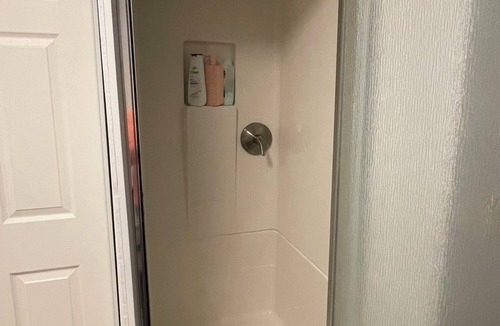 Fairbanks Apartment | Studio with a Queen bed, shower cabin and toilet, shared access to free laundry