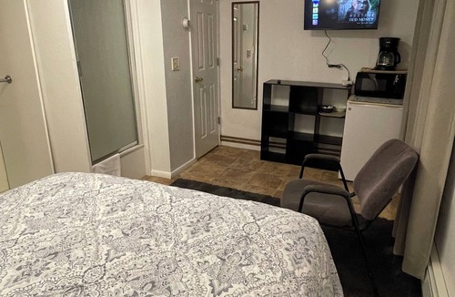 Fairbanks Apartment | Studio with a Queen bed, shower cabin and toilet, shared access to free laundry