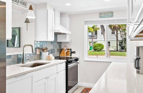 Holmes Beach House | While Away A · EV Charger · Fenced Pool · Renovated 2025