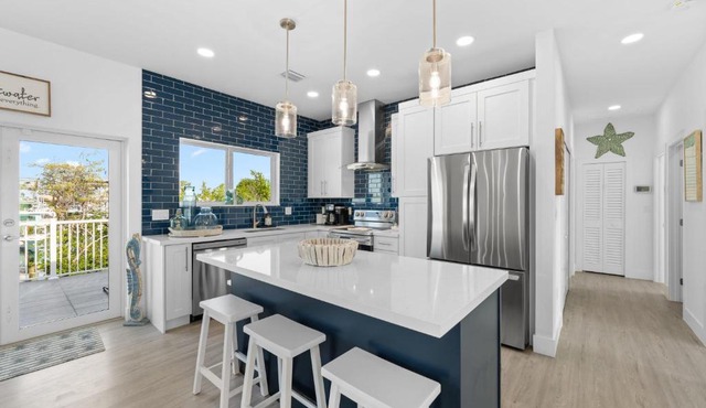 Blue Pearl New Waterfront Haven with Heated Pool ,70 Foot Dock, and More!