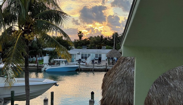 Canal side location with beach & pool club membership!