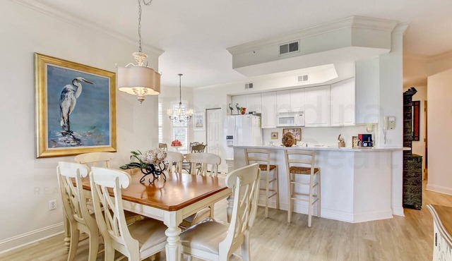 Ground floor unit in gated community. Tastefully decorated and located on southern end of Island.