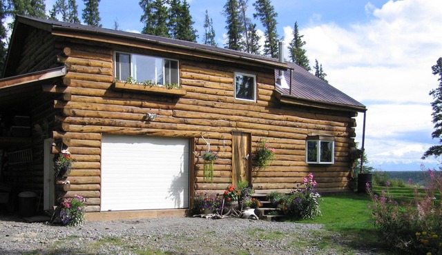 Perched on a high bluff over the Copper River, with an Awesome Mountain View