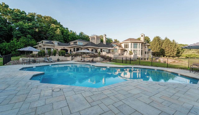 Private 100-acre luxury estate for up to 30 guests with a resort-style pool, hot tub, game room, sports court, wellness spa, and sweeping sunset views—perfect for reunions, retreats, and unforgettable group stays.