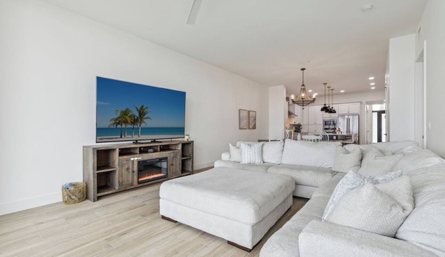 Sleek Coastal Condo with Stunning Riverfront Views and Luxury Amenities