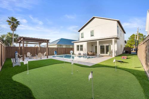 Steps to Gulf | 4BR w/Private Pool, Putting Green, Fire Pit & Golf Simulator – Sleeps 14