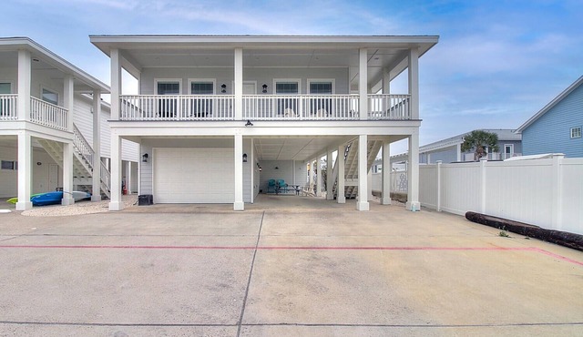 This charming beach bungalow is located right next to the community pool and clo