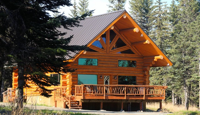 Unique Alaskan log home in trees & wild flowers on 14-acre private homestead.