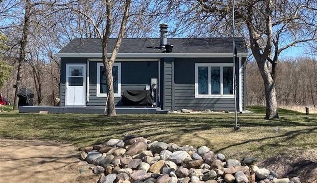 Year round cabin on level lot with dock